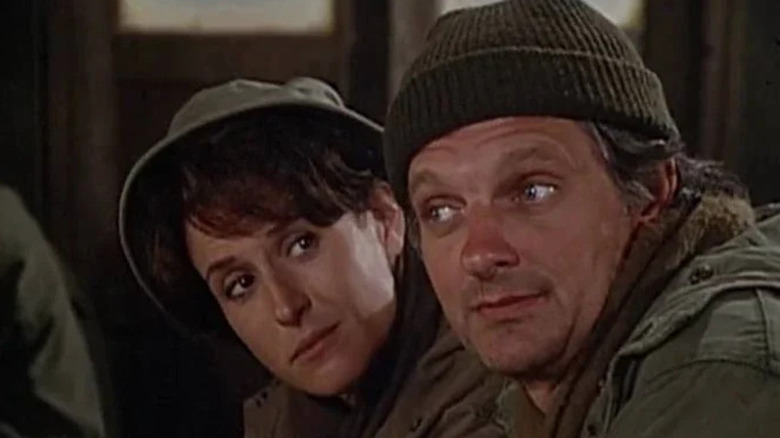 Peggy Bigelow (Enid Kent) glances at Hawkeye Pierce (Alan Alda) in M*A*S*H