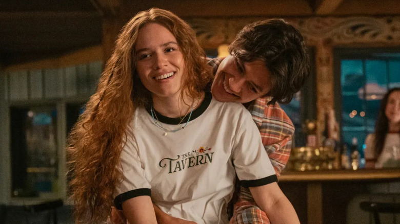 Matt Cornett as Sam hugging Sadie Soverall as Percy from behind in Every Year After