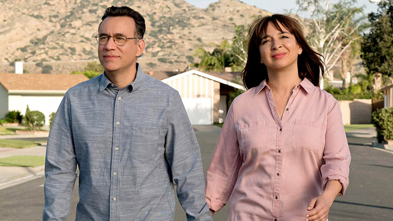 Fred Armisen and Maya Rudolph as Oscar and June walking down the street in Forever