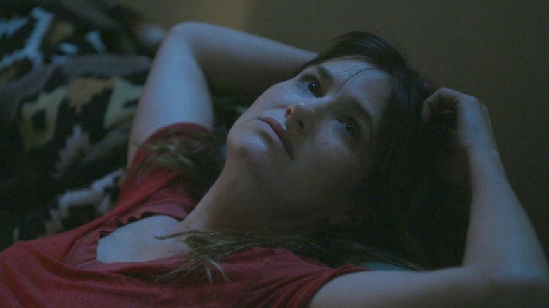 Kathryn Hahn as Chris lying back on a couch in I Love Dick
