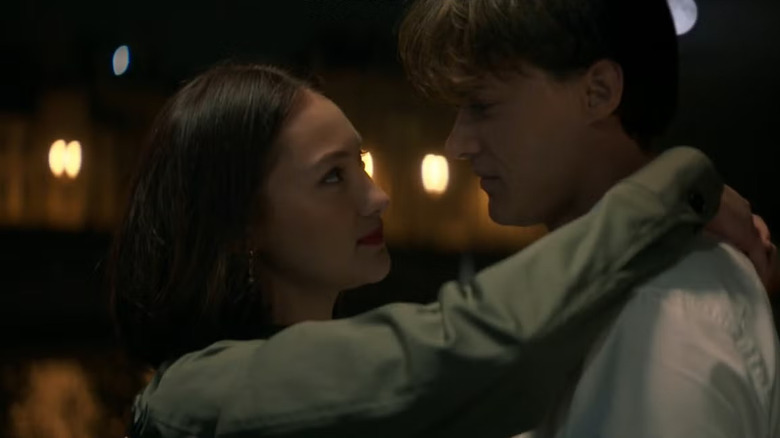 Lola Tung as Belly with her arms around Christopher Briney as Conrad in The Summer I Turned Pretty