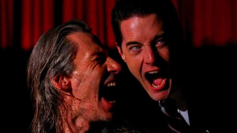 Killer BOB (Frank Silva) and Dale Cooper (Kyle MacLachlan) laugh sinisterly in Twin Peaks