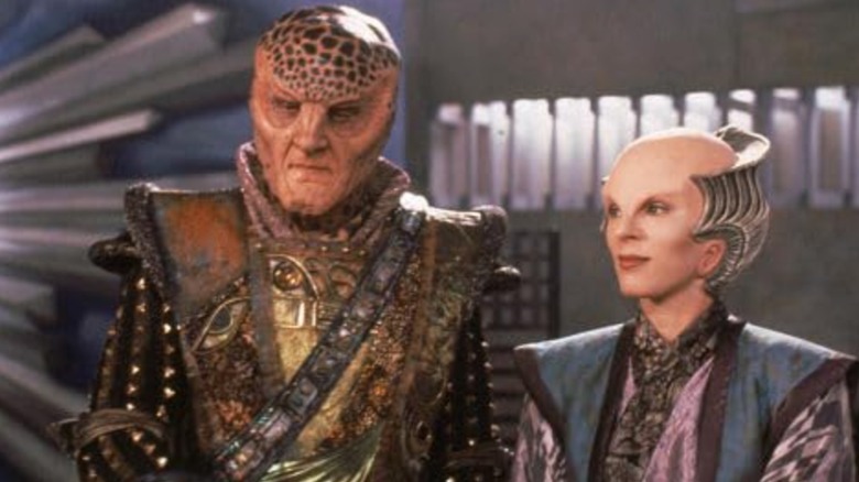 Ambassador G'Kar looks downward while Ambassador Delenn looks off to the side in "Babylon 5."