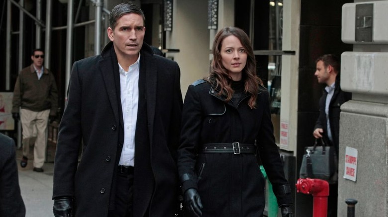 John Reese and Root gaze forward, slightly alarmed, in "Person of Interest."