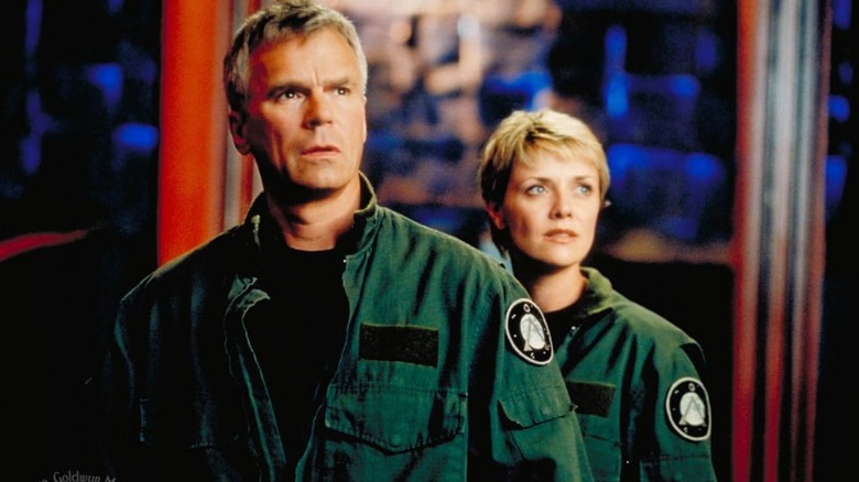 Col. Jack O'Neill and Samantha Carter look off and to the side in "Stargate SG-1."