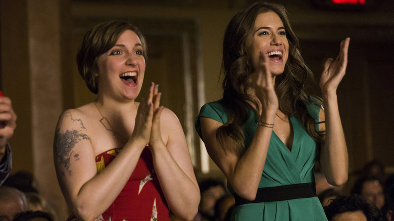 Hannah (Lena Dunham) and Marnie (Allison Williams) applaud in Girls