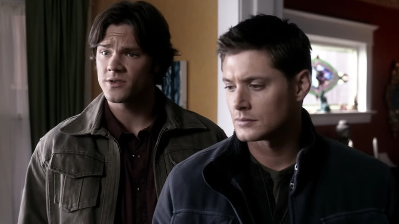 Sam (Jared Padalecki) and Dean (Jensen Ackles) standing next to each other on "Supernatural."