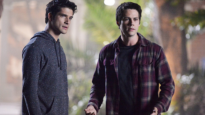 Tyler Posey as Scott and Dylan O'Brien as Stiles standing next to each other in Teen Wolf