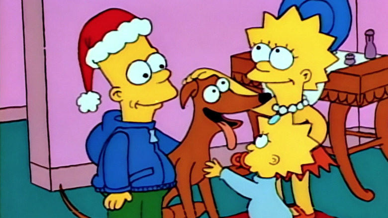 Bart, Lisa, and Maggie pet Santa's Little Helper in "The Simpsons."