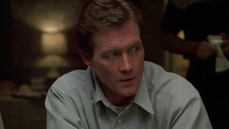 Robert Patrick as Davey Scatino, at a table in The Sopranos.