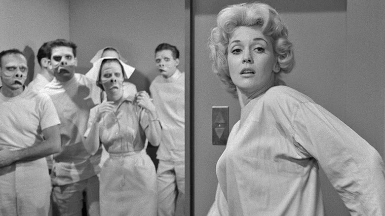 Doctors and nurses staring at Janet Tyler