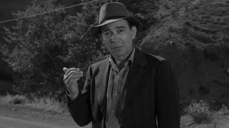 A hitchhiker sticks his thump up in The Twilight Zone