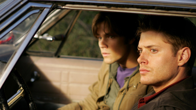 Sam Winchester sits next to Dean Winchester in Supernatural