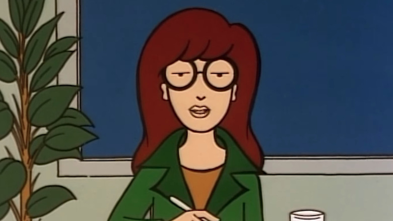 Tracy Grandstaff as Daria sits in front of a window on Daria