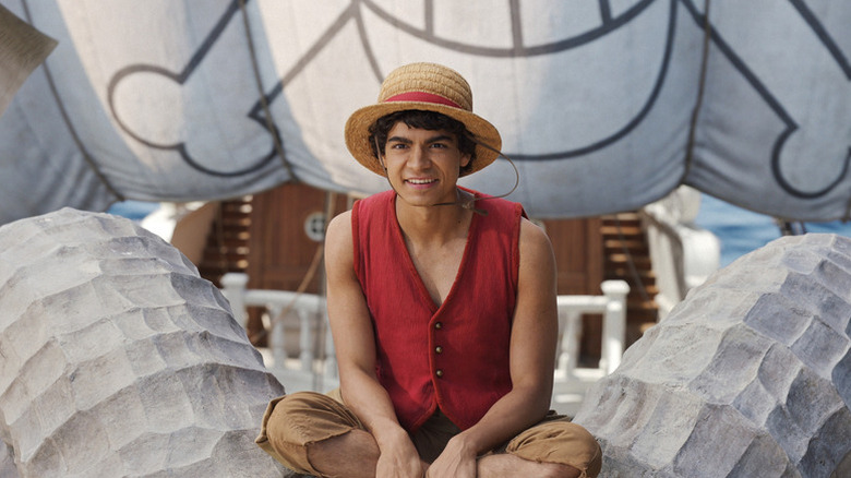 Monkey D. Luffy sitting on a ship's bow