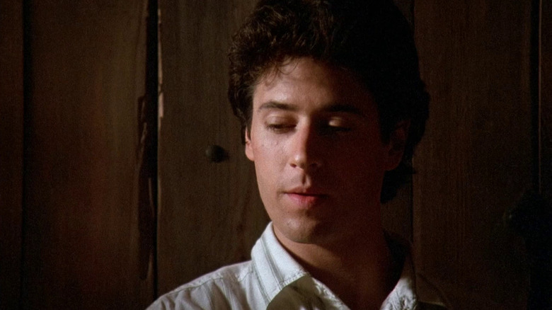 Joel Fleischman (Rob Morrow) sits in a dark room in Northern Exposure