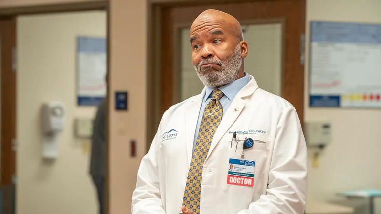 Ron (David Alan Grier) smirks in a hospital in St. Denis Medical
