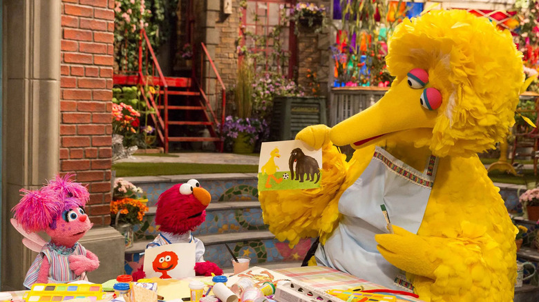 Abby and Elmo doing arts and crafts with Big Bird on Sesame Street