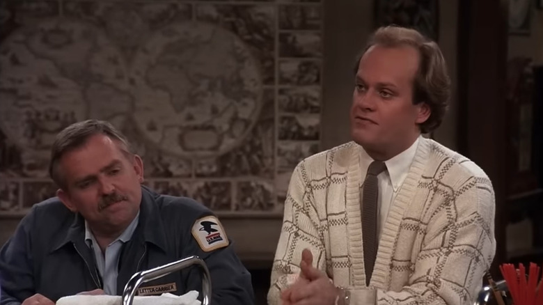 Kelsey Grammer as Dr. Frasier Crane talks to John Ratzenberger as Cliff Clavin on Cheers