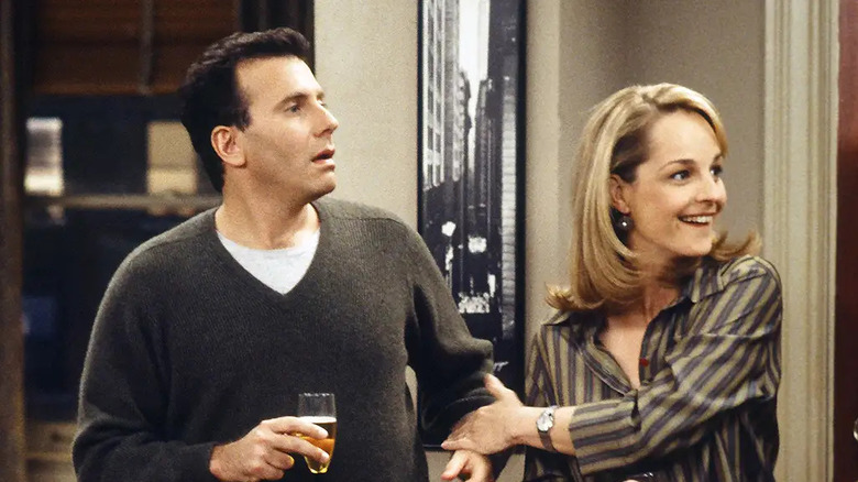 Paul Reiser as Paul Buchman stands next to Helen Hunt as Jamie Buchman on Mad About You