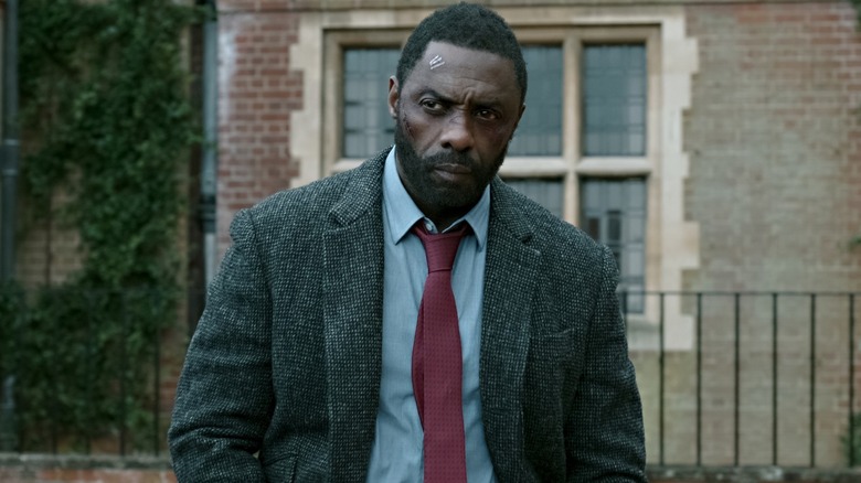 Idris Elba with face bandages as John Luther