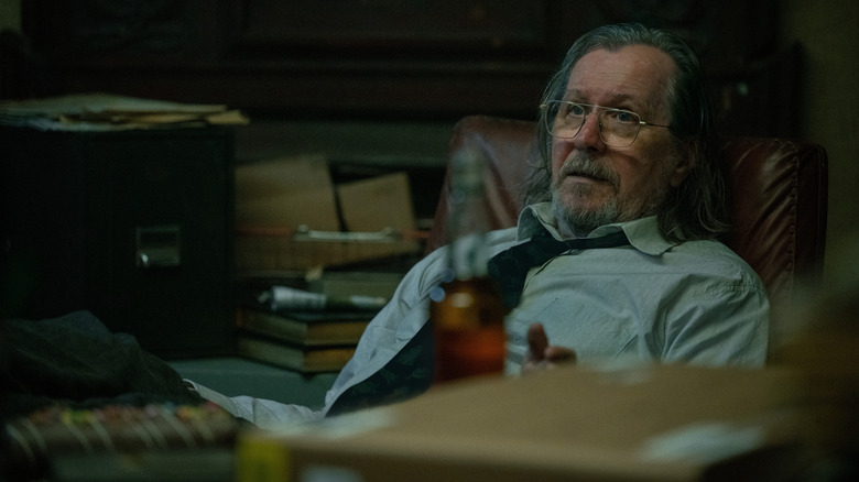 Gary Oldman as Jackson Lamb sitting back in a chair in Slow Horses