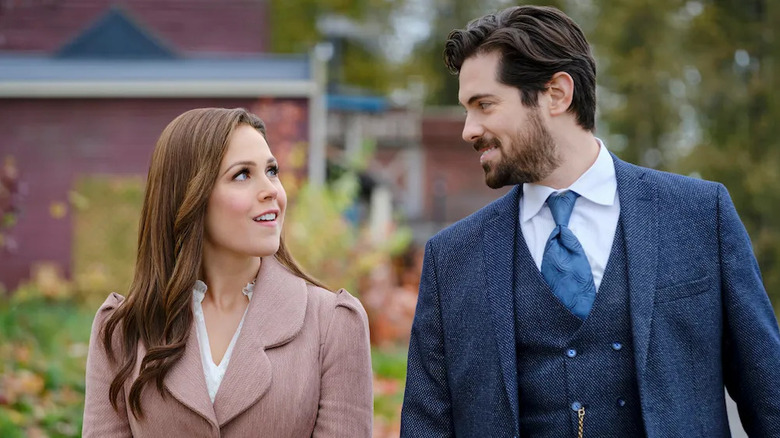 Elizabeth Thatcher (Erin Krakow) glances up at Lucas Bouchard (Chris McNally) in When Calls the Heart
