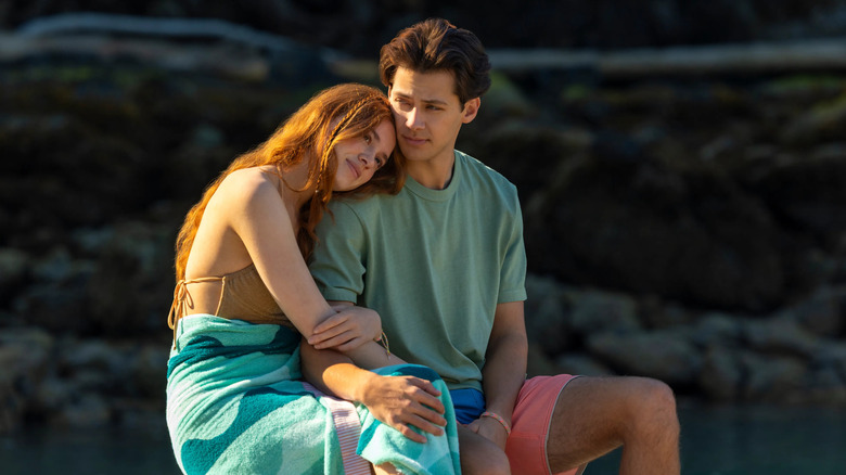 Percy Fraser (Sadie Soverall) rests her head on the shoulder of Sam Florek (Matt Cornett) in Every Summer After