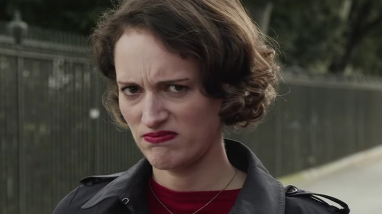 Fleabag (Phoebe Waller-Bridge) frowns at the camera in Fleabag