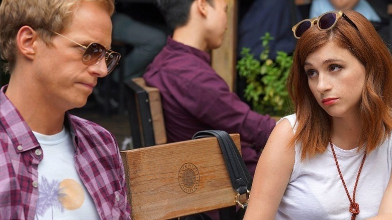 Gretchen Cutler (Aya Cash) glances expectantly at Jimmy Shive-Overly (Chris Geere) in You're the Worst