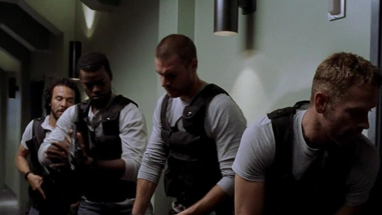 A group of soldiers preparing to breach a room