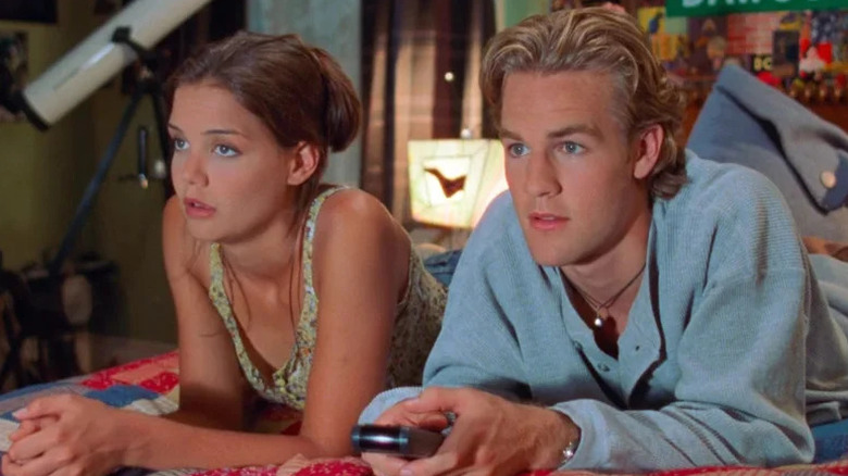 Katie Holmes as Joey laying in the bed next to James Van Der Beek as Dawson in Dawson's Creek