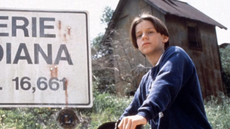 Omri Katz as Marshall Teller sits on a bike in Eerie, Indiana