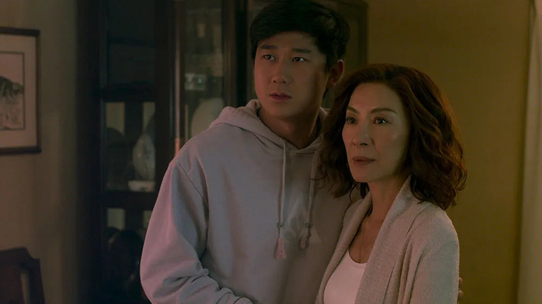 Bruce Sun (Sam Song Li) stands next to Eileen Sun (Michelle Yeoh) in The Brothers Sun