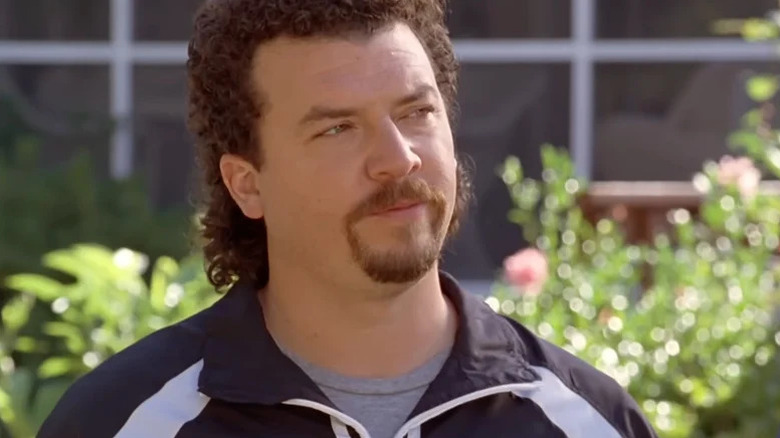 Kenny Powers (Danny McBride) stands smugly in a garden in Eastbound & Down