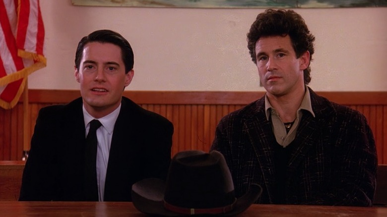 Agent Cooper (Kyle MacLachlan) and Sheriff Truman (Michael Ontkean) sitting side by side on Twin Peaks S1E1