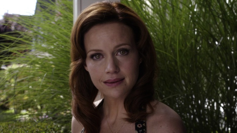 Kate (Carla Gugino) staring intently and ominously on Wayward Pines S1E1