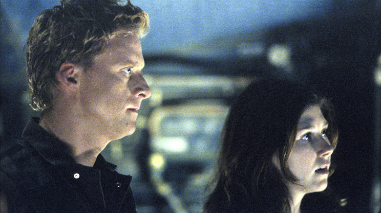 Hoban (Alan Tudyk) and Kaylee (Jewel Staite) looking forward on Firefly