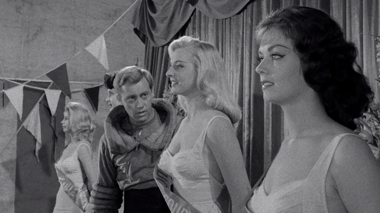 Peter Kirby (Don Dubbins) examines a line of beauty pageant contestants in "The Twilight Zone."