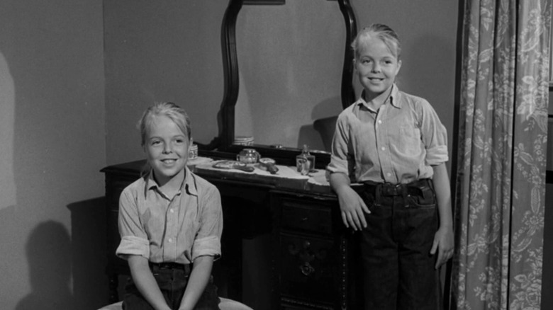 Two versions of Jenny (Susan Gordon) smile next to each other in "The Twilight Zone."