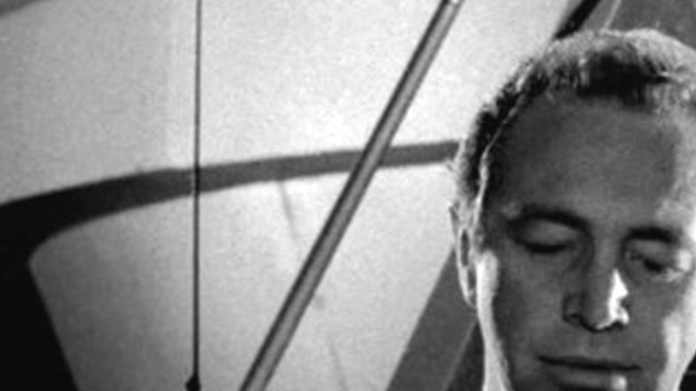An alien (Sheldon Allman) and his companion (Bill Walsh) observe a community from their spaceship in "The Twilight Zone."