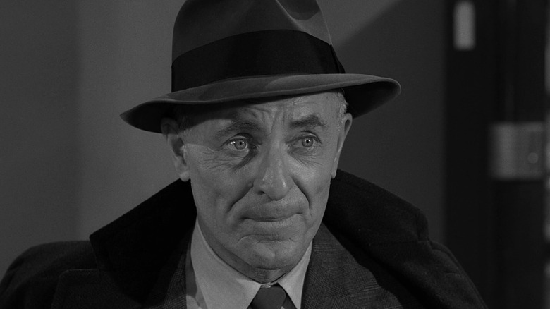 Ross (John Hoyt) sits inquisitively in The Twilight Zone (1959)