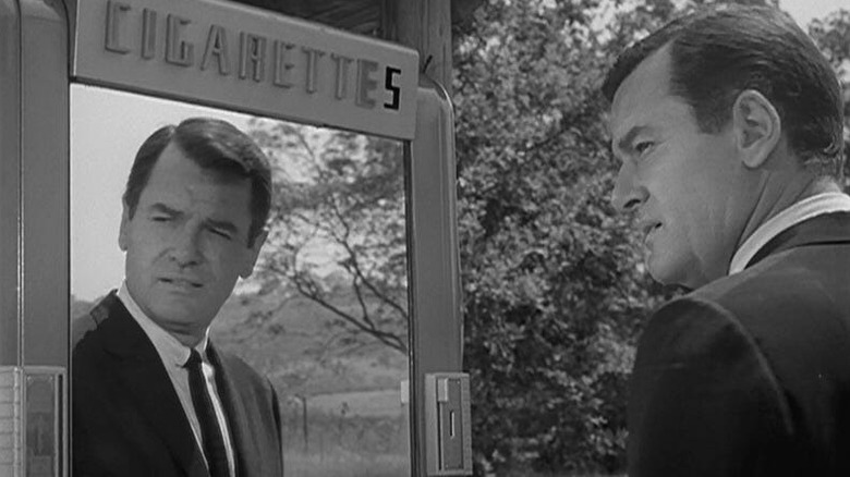 Martin (Gig Young) standing in front of a mirror on "The Twilight Zone."