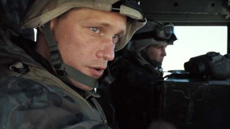 Sgt. Brad "Iceman" Colbert sitting in a humvee