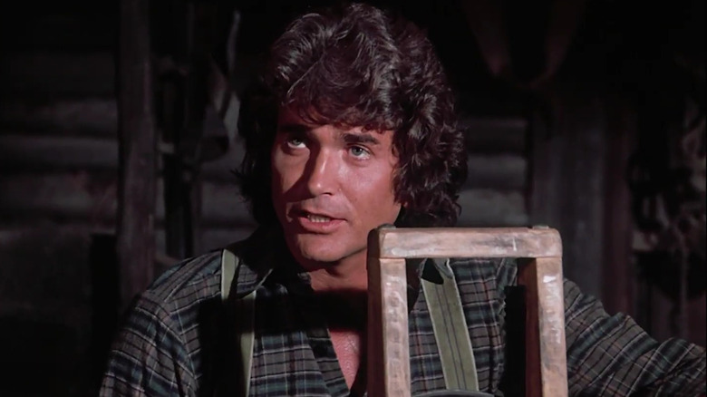 Michael Landon as Ingalls patriarch Charles, doing carpentry on Little House on the Prairie
