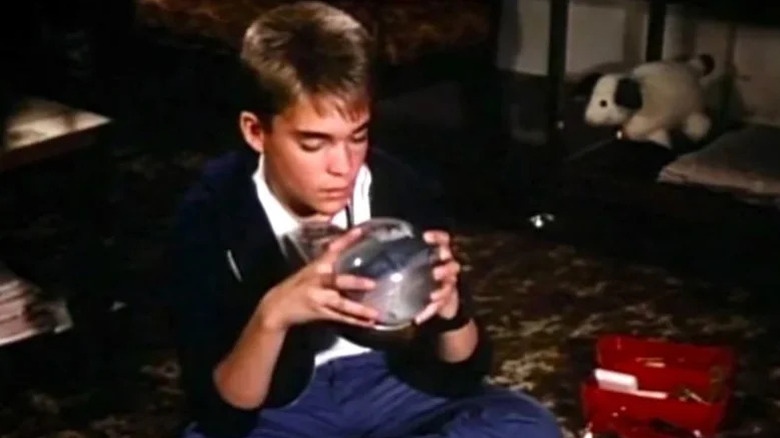 Chad Allen as Tommy Westphall, imagining the entirety of St. Elsewhere in a snow globe.