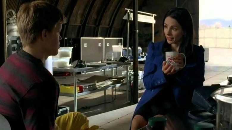 Jesse Plemons as Todd sitting across from Laura Harrier as Lydia drinking coffee in a meth lab in Breaking Bad