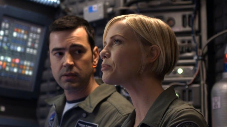 Maddux (Ron Livingston) looking at Zoe (Laura Harris) on "Defying Gravity."