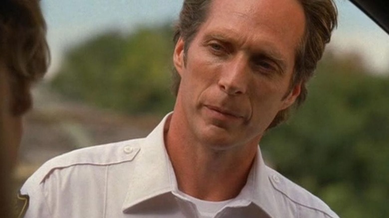 Sheriff Tom Underlay (William Fichtner) looking forward in Invasion