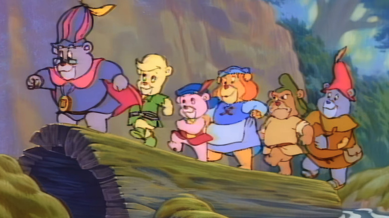The Gummi Bears march on a log in Adventures of the Gummi Bears